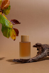 Glass cosmetic bottle with wooden trunk, container mockup