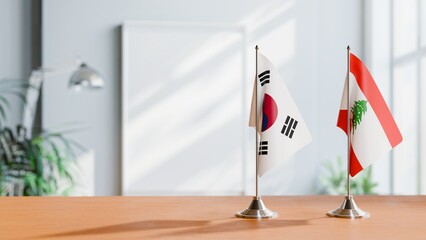 FLAGS OF KOREA SOUTH AND LEBANON ON TABLE
