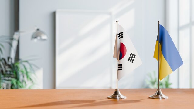 FLAGS OF KOREA SOUTH AND UKRAINE ON TABLE