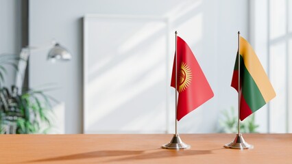 FLAGS OF KYRGYZSTAN AND LITHUANIA ON TABLE