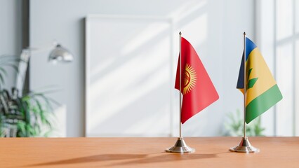 FLAGS OF KYRGYZSTAN AND SAINT VINCENT ON TABLE