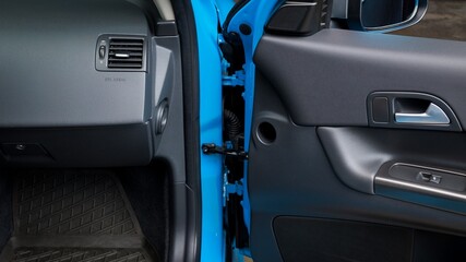 Passenger door of a car open