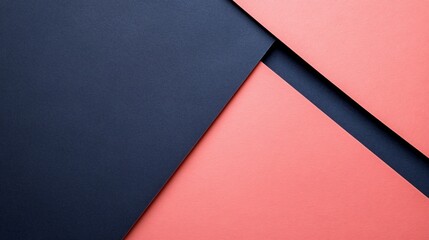 Colorful papers in blue and coral create a modern, artistic composition with sharp angles