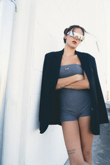Modern girl wearing sunglasses on the street