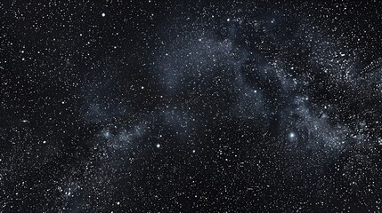 Fototapeta premium A starry night sky with white stars and nebulae.
