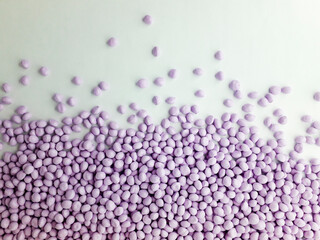 Lavender masterbatch granules on white background,color pigment carrier polymer in plastic...