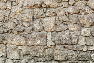 Texture wall stone sandstone with shadows and deep pattern. Clinker tiles or bricks on the wall in the form of wild stone