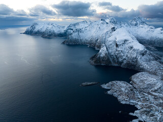 The Beauty of SnowCapped Mountains Paired with a Serene and Picturesque Waterscape