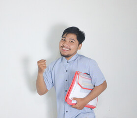 asian man look so happy and success while holding documents
