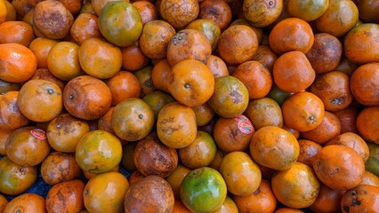 Fresh and Ripe oranges in the market in Thailand