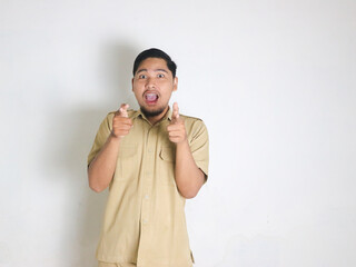 An Asian male Indonesian civil servant wearing a brown uniform who is usually called a keki is...