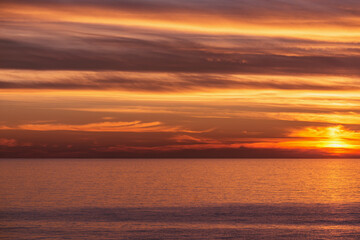 Amazing sunset sky above the sea.