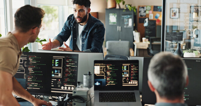 Men, discussion and programmer with computer for coding solutions, problem solving or idea at office. Male people, designers or developers working on technology for software development at workplace