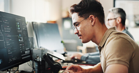 Computer, programming and web development with coder man in creative workplace for design. Coding,...