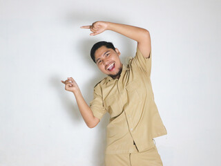 An Asian male Indonesian civil servant wearing a brown uniform who is usually called a keki is...