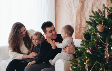 family on the couch during christmas holiday