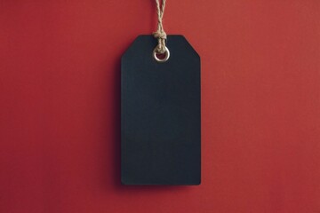 Fototapeta premium Empty Black Price Tag on Red Background
