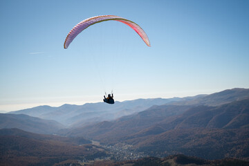 Paragliding in Ciucas mountains, Romania, during autumn season