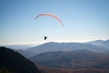 Paragliding in Ciucas mountains, Romania, during autumn season