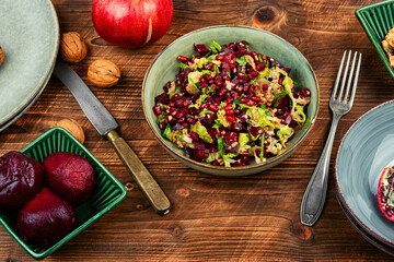 Healthy vegan beetroot salad with walnuts.