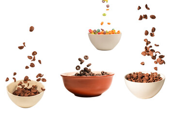 Chocolate corn flakes falling to the white bowl isolated on white. Motion.
