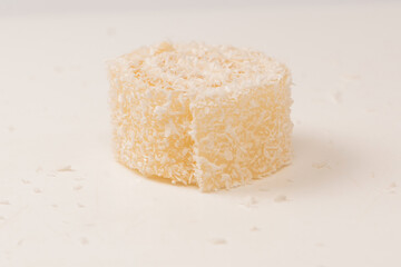 Coconut candy roll isolated on a white background.