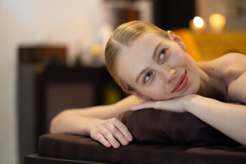 Obraz premium Thai Massage and spa therapy. Beautiful caucasian Woman Getting service aromatherapy massage Spa Treatment