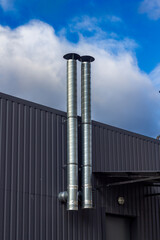 Two gray hoods. Organization of ventelation factory