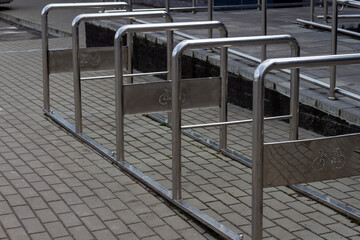 Bicycle parking in the city. Metal structure for parking in chrome color