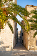 Narrow old stone street in the town of Pag on the island of Pag, Croatia © TatiG