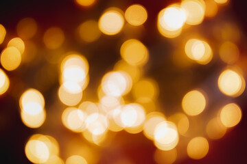 Obraz premium Golden Bokeh Lights Blurred Background for Festive Celebrations