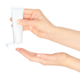 Woman hand holds a white cosmetic cream tube, on transparent background close-up, template for cosmetics ads