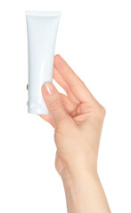 Woman hand holds a white cosmetic cream tube, on transparent background close-up, template for cosmetics ads
