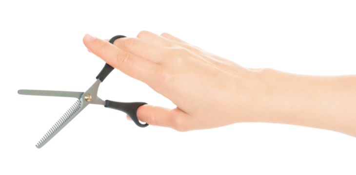 Woman hand holds Office Scissors, isolated on transparent background, stationery concept