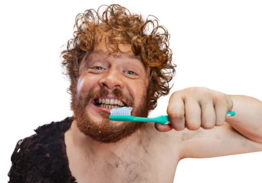 Cheerful man in character of neanderthal brushing teeth with toothpaste against transparent background. Concept of history, modern and ancient combination, evolution and ad