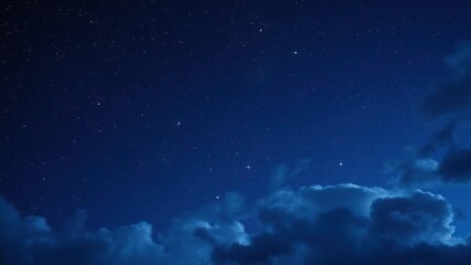 A deep indigo sky is dotted with twinkling stars and constellations, set against a backdrop of swirling cosmic clouds that evoke the mystery and wonder of the universe, zodiac, night sky, space