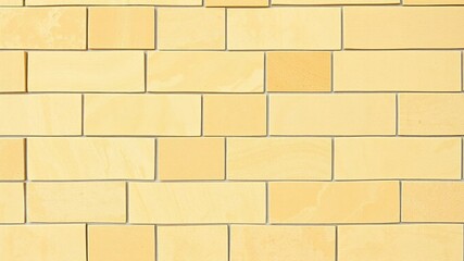Naklejka premium A seamless arrangement of yellow natural sandstone tiles on a wall background creates a stunning visual effect, geometric pattern, yellow color palette