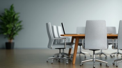 Modern empty conference room with wooden table, grey chairs, and laptop.