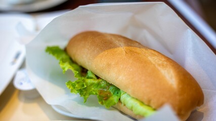The crispy-on-the-outside, soft-on-the-inside French baguette, paired with refreshing lettuce, is incredibly appetizing.