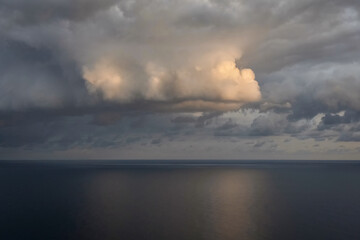 Stormy dark clouds over the Black Sea water.