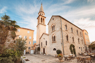 Obraz premium Church of st. John in Budva old town, Montenegro, showing stone architecture and bell tower