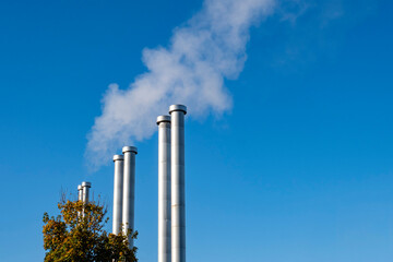 pipes white steam blue sky heating boiler heat Netherlands autumn
