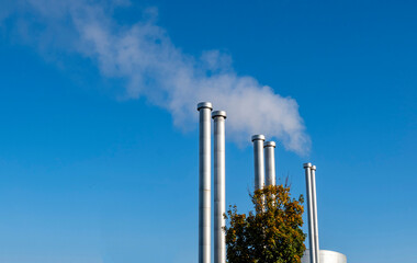 pipes white steam blue sky heating boiler heat Netherlands autumn