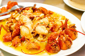 a plate of shrimp with a yellow sauce on it