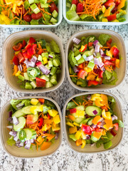 Meal Prep with Colorful Salads in Containers