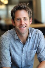 Fototapeta premium Portrait of a smiling man in casual outfit in modern indoor setting