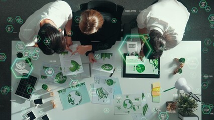 Top view of business team discussing about using clean energy and sustainable investment at meeting...