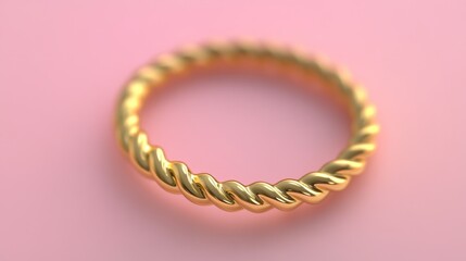 Obraz premium Elegant and Delicate Gold Twisted Ring on a Soft Pink Background, Signifying Luxury, Beauty, and Timeless Style for Jewelry Enthusiasts and Fashion Lovers