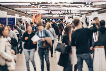 Abstract blurred people at exhibition hall of expo event trade show. Business convention show or...