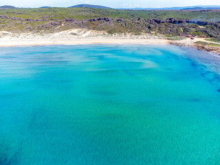 Obraz premium Aerial view of turquoise water in a beach in Sardinia